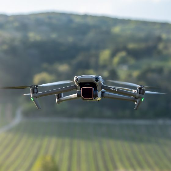 Photo of a medium sized drone. It's the DJI Mavic 3 of award winning aerial filmmaker Dronographer.