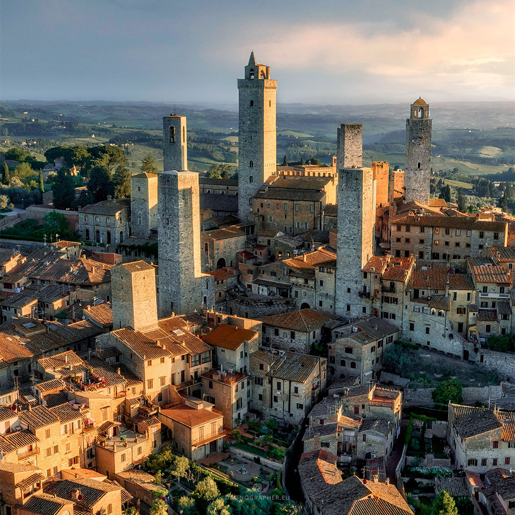 A city in Tuscany, with many towers. It looks like medieval Manhatten.