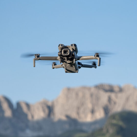 Photo of a small sized drone. It's the DJI Mini 5 Pro of award winning aerial filmmaker Dronographer.
